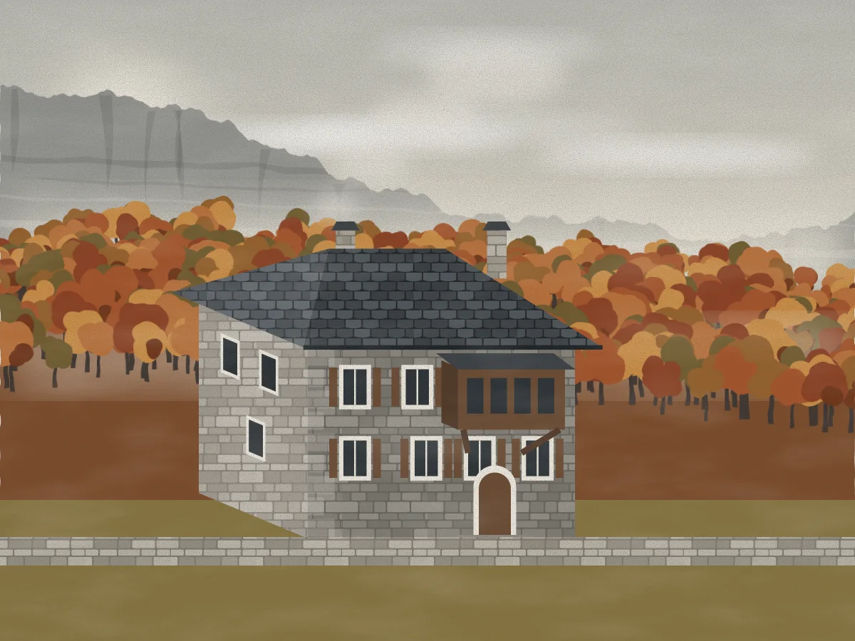 The restored house in autumn: grey stone, a new slate roof, the timber bay window and smoke from the chimney